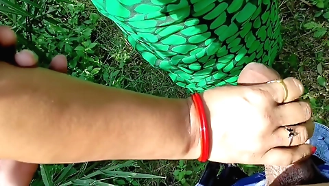 Amateur brunette girl giving me a good handjob on the ground