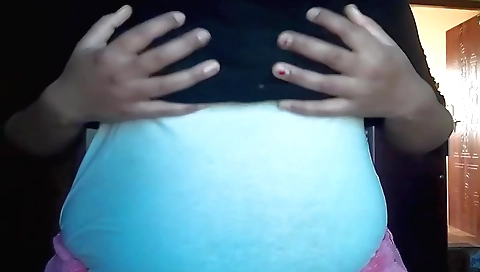 A brunette with a hot body is masturbating in her bedroom