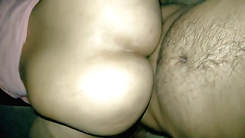 Indian mom in a bathroom with her legs raised on the basin