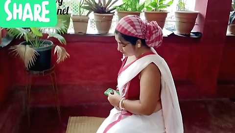Indian woman is playing with her feet in her white lingerie
