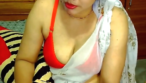 Indian pornstar with big tits sucks a dick in camera
