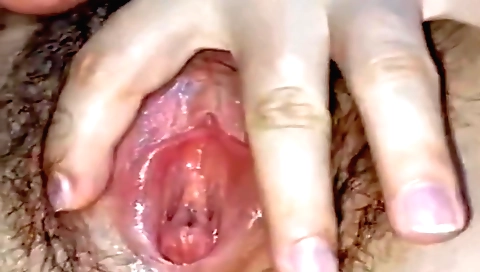 Hairy girl in a sexy black lingerie makes her pussy wet