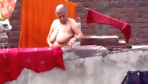 Indian granny shows her big natural boobs outdoors