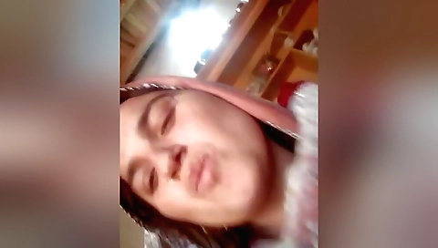 Amateur brunette with big tits is having sex with a guy