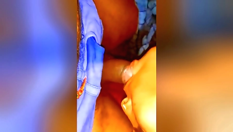 A hairy brunette chick in a white headband on a couch