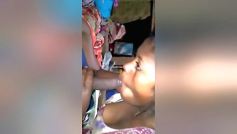 Indian brunette handjob in a red dress and black socks