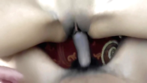 Newly married couple getting intimate in the kitchen