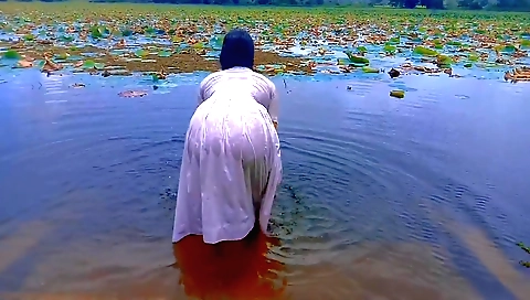 Brunette milf plays and bathes nude in the outdoors