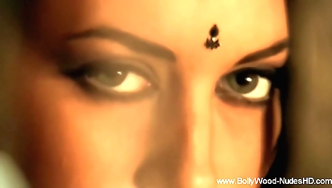 Nude brunette naked in the bedroom with the camera